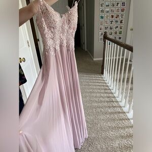 This is a very beautiful dress that I unfortunately grew out of before prom.